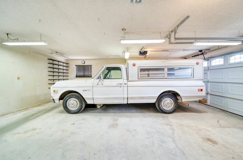 Two-car garage with a truck on a bare concrete slab, ready for a coating
