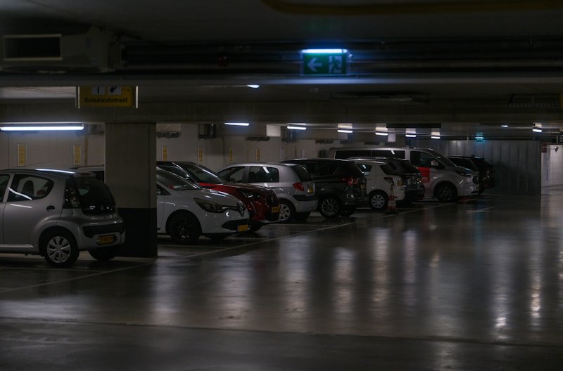 Cars parked on a coated floor in a covered garage